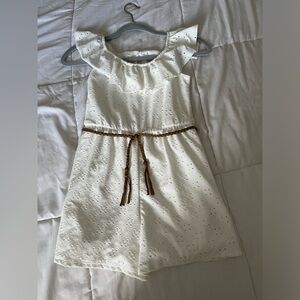White romper with cute brown belt.